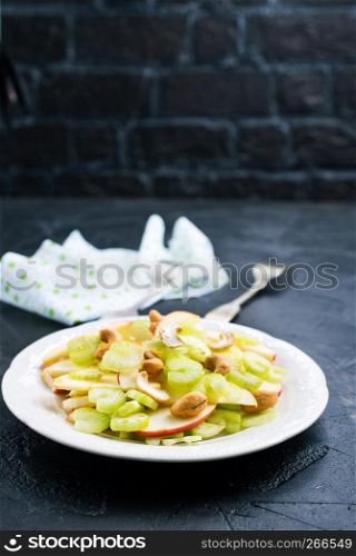 fruit salad with nuts on the plate