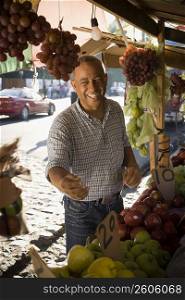 Fruit seller smiling and looking sideways, Santo Domingo, Dominican Republic
