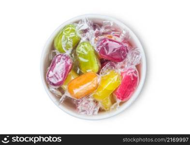 Fruit Sherbets sweet candies in white ceramic bowl on white background.Top view
