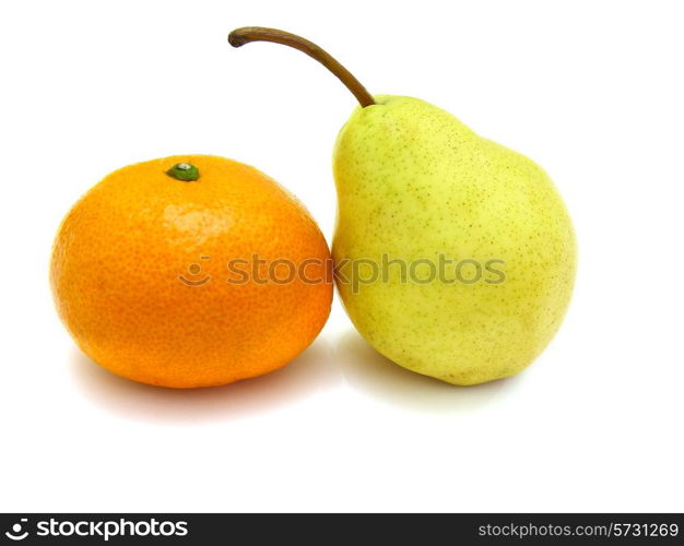 Fruit, tangerine and pear lie on a white background