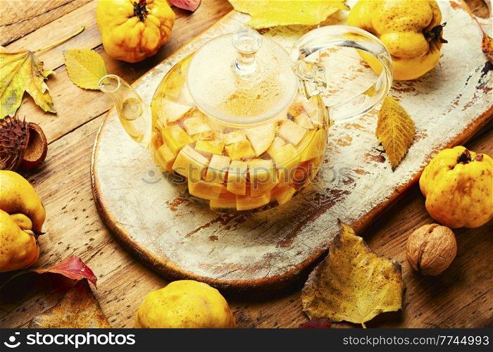 Fruit tea from autumn quince.Autumn beverage, hot apple tea drink. Autumn tea with quince
