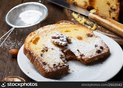 Fruitcake with nuts, raisin and sugar powder
