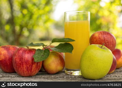 fruits and peach juice on a wooden table, outdoor