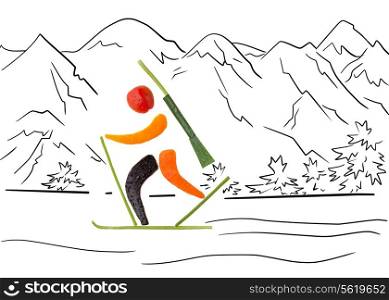 Fruits and vegetables in the shape of a biathlete skiing a penalty loop.