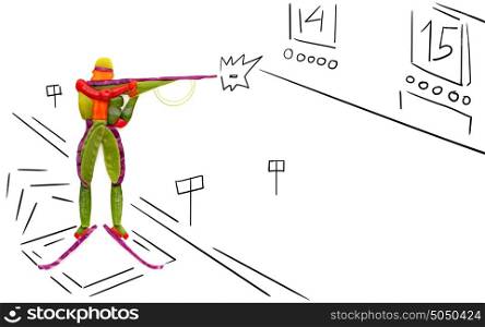 Fruits and vegetables in the shape of a biathlete with a rifle in the shooting area.