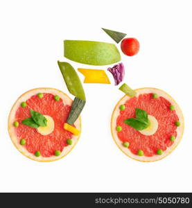 Fruits and vegetables in the shape of a cyclist on a bike.