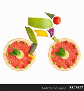 Fruits and vegetables in the shape of a cyclist on a bike.