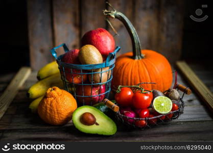 Fruits and vegetables on wooden background