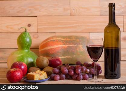 fruits and wine on wooden table, studio picture. fruits and wine