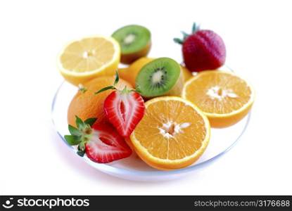 Fruits in a bowl on white background