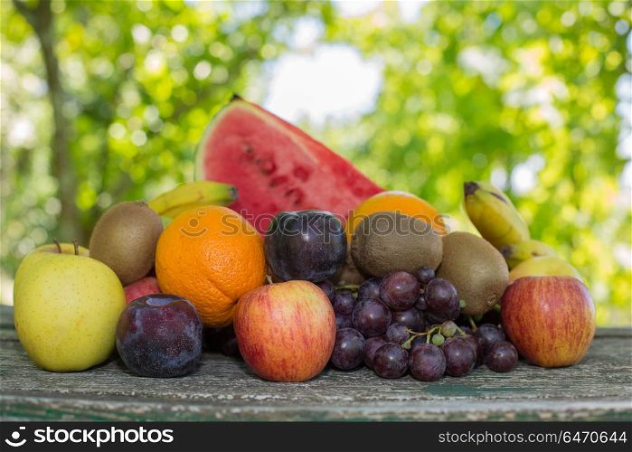 fruits in wooden table, outdoor. fruits