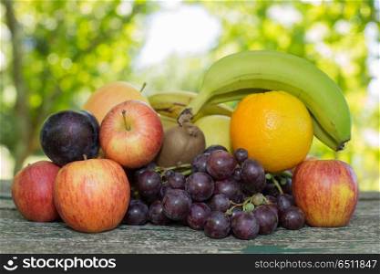 fruits in wooden table, outdoor. fruits