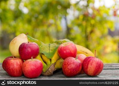 fruits in wooden table outdoor in the garden