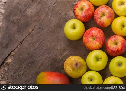 fruits on a old wooden table, studio picture, with copy space. Free space for text
