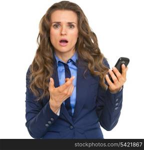 Frustrated business woman pointing on cell phone