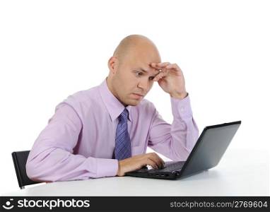 Frustrated businessman in front of laptop. Isolated on white background