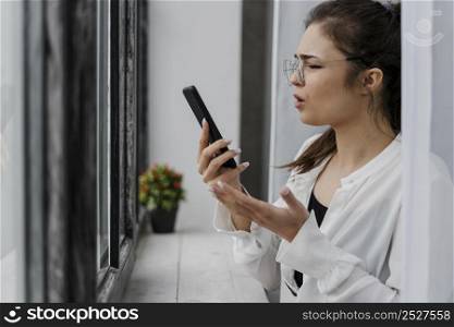 frustrated girl looking her phone