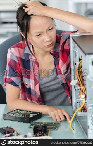frustrated intern trying to fix a computer