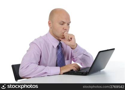 Frustrated man in front of laptop. Isolated on white background