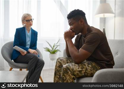 Frustrated military patient talk to doctor psychologist on therapy session. Frustrated military patient talk to doctor psychologist