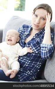 Frustrated Mother Suffering From Post Natal Depression