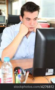 Frustrated student in front of his computer