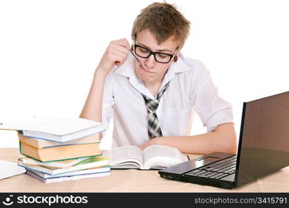 frustrated student sits behind a desk isolated on white background