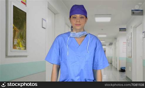 Frustrated surgeon wearing a cap in hall