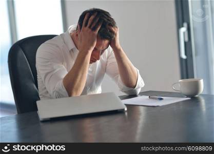 frustrated with problems young business man working on laptop computer at home