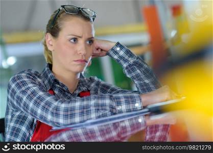 frustrated woman at auto repair shop