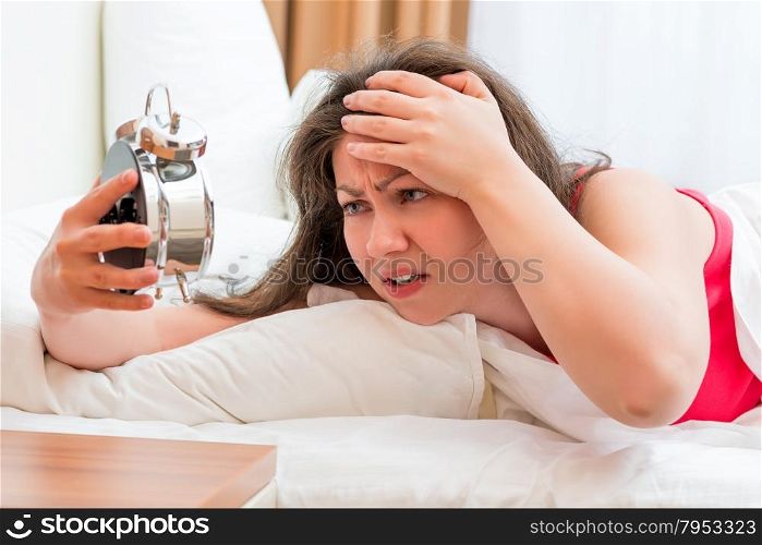 frustrated woman trying to sleep with insomnia