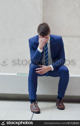 frustrated young business man working on laptop computer at office