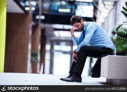 frustrated young business man working on laptop computer at office