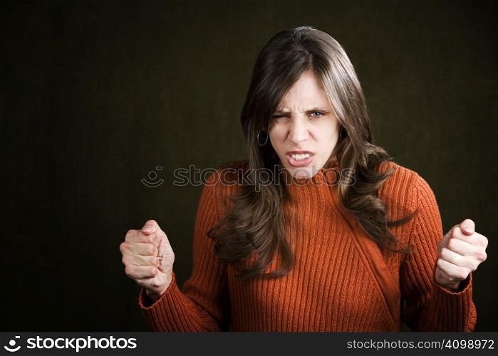 Frustrated Young Woman in an Orange Sweater
