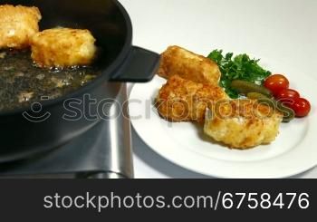 frying chicken breast roll on a pan.