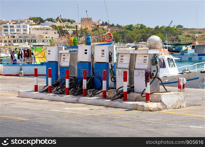 Fuel gas stations in the fishing port of the village of Marsaxlokk. Malta.. Fuel station for boats in the village Marsaxlokk