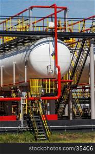 Fuel tank and pipelines on oil refinery plant. Fuel tank and pipelines
