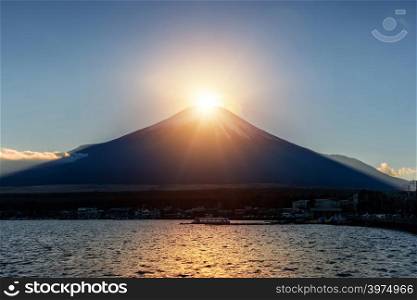 Fuji Diamond at Lake Yamanaka in winter season. Diamond Fuji is the name given to the view of the sun meeting the summit of the mountain, Japan