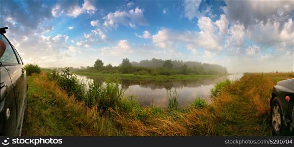 full 180 degree panorama beautiful of summer morning nature with grass and river. Summer misty morning river wide angle panorama. Car sides
