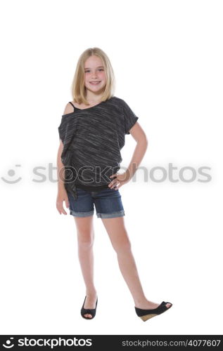 Full body front view of a pretty young girl, looking forward, isolated on white