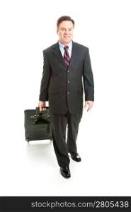 Full body isolated view of a business traveler carrying his rolling suitcase.
