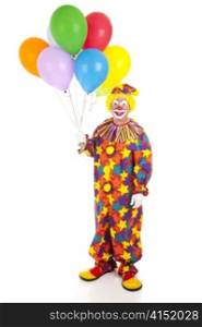 Full body isolated view of a happy clown holding a bunch of colorful balloons.
