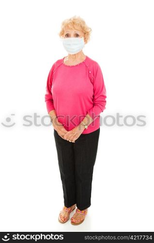 Full body isolated view of a senior woman wearing a face mask to protect against an epidemic.