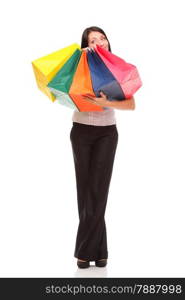 Full body portrait of a cheerful businesswoman holding shopping bags. Concept of commerce and finance in business. Isolated on white