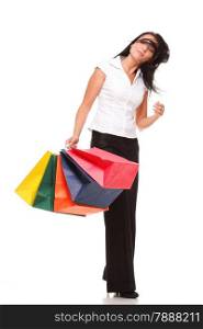 Full body portrait of a cheerful businesswoman holding shopping bags. Concept of commerce and finance in business. Isolated on white