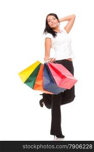 Full body portrait of a cheerful businesswoman holding shopping bags. Concept of commerce and finance in business. Isolated on white