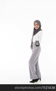 Full body portrait of Confident happy smiling female muslim woman with EDC machine as owner merchant concept. Studio shot on white background. Using for sale consumerism and shopaholic concept.