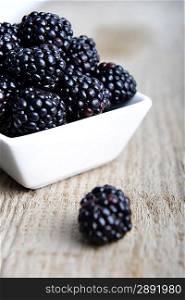 full bowl of ripe fresh blackberries, closeup