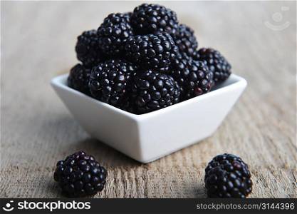 full bowl of ripe fresh blackberries, closeup