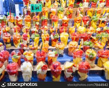 Full colors in this detail of fruit salads exposed in a Spanish market